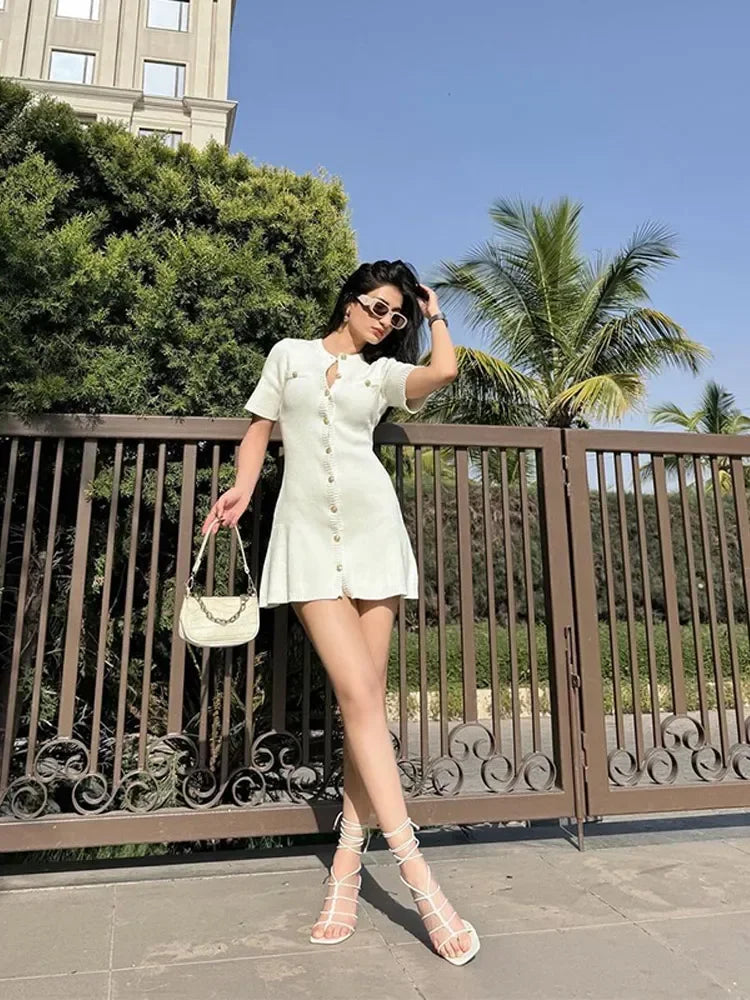 Find the Fitted Knit Mini Dress with a soft stretch, O-neck, and mini length. A chic choice for office days and outings.