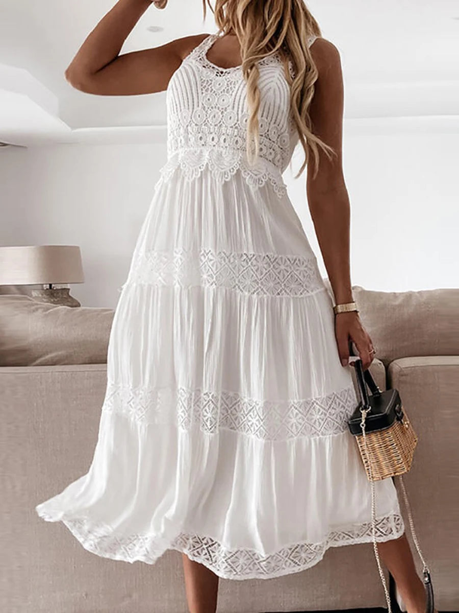 Find a White Maxi Beach Dress with an elegant strapless style and ruffle details. Perfect for summer outings and beach days.