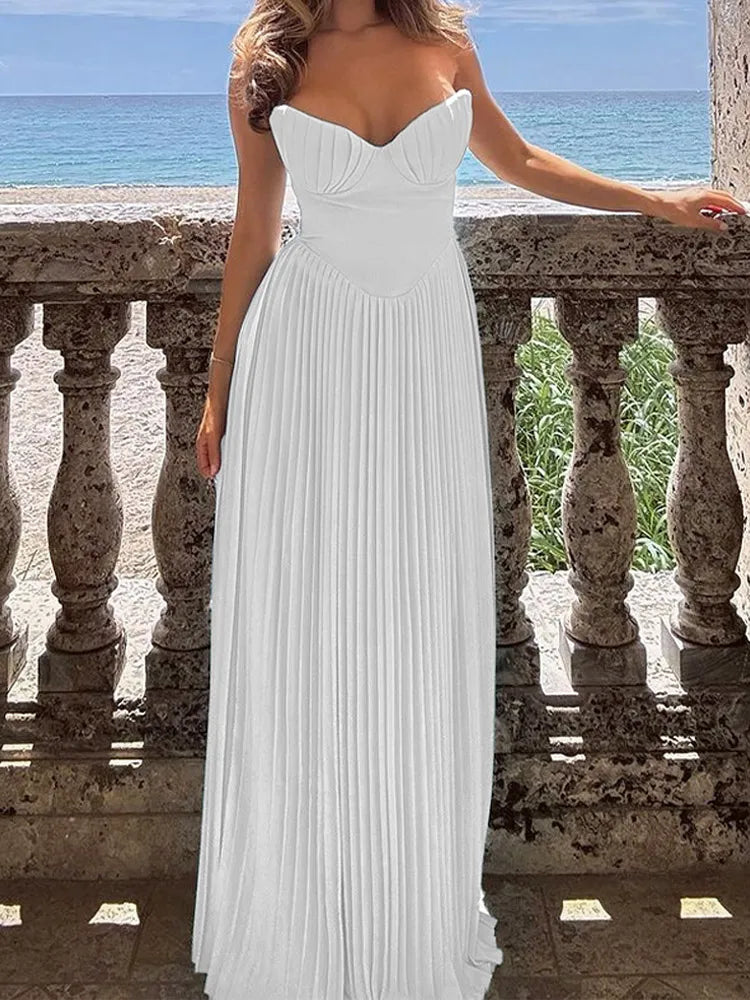 Elevate your occasion wardrobe with the Off-Shoulder Pleated Maxi Dress, featuring a sleek silhouette, and ankle-length design.