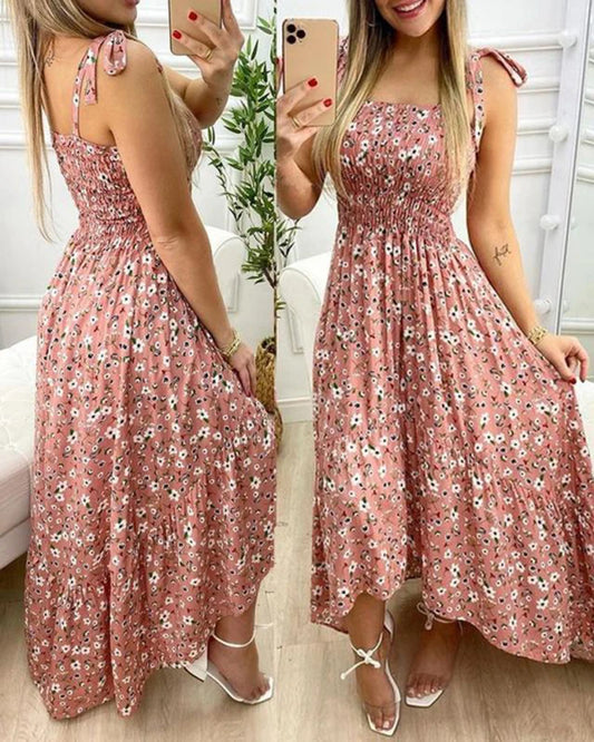 Refresh your wardrobe with a floral spaghetti strap maxi dress featuring an elegant long silhouette and feminine floral details.