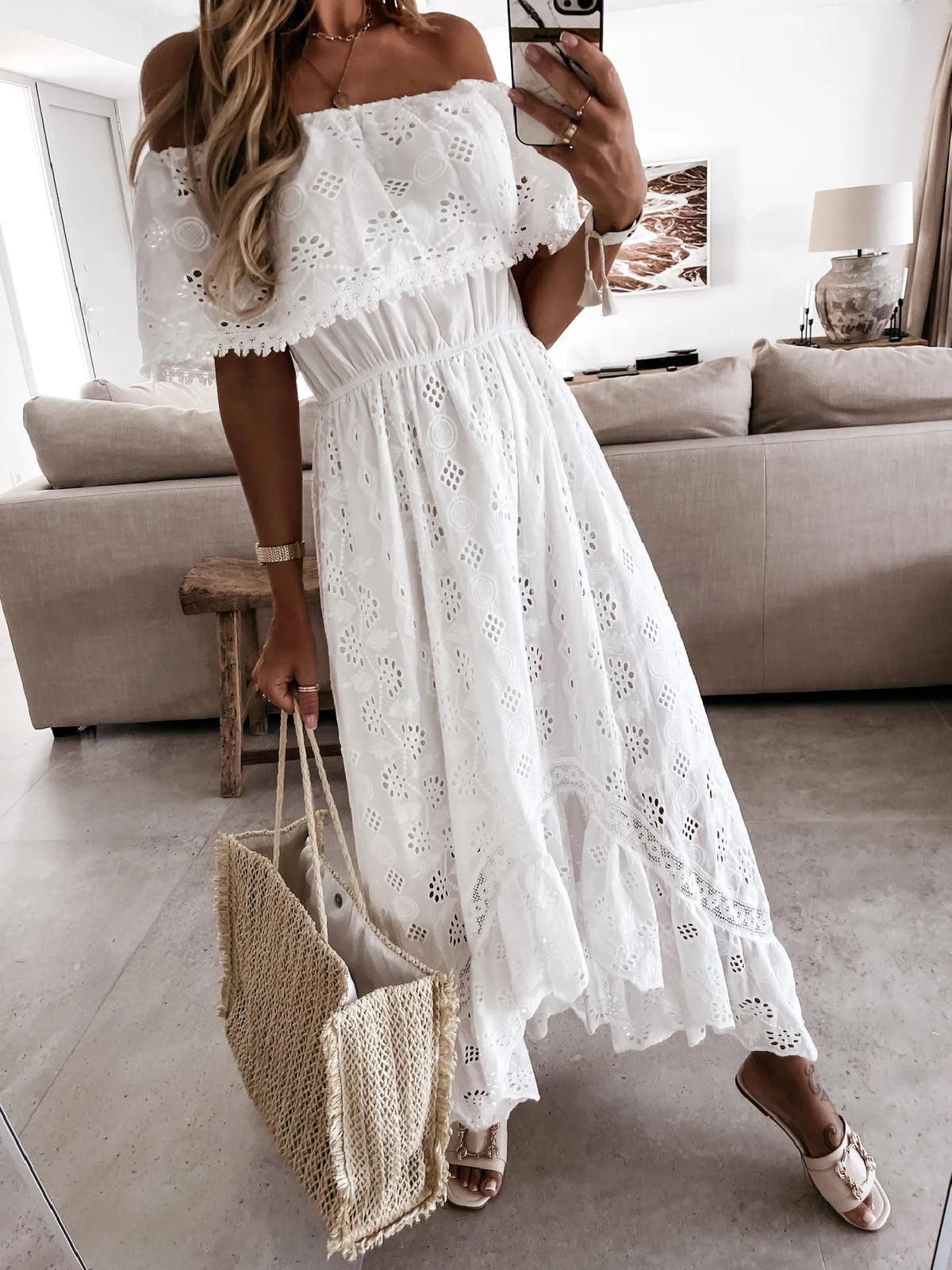 Find a White Maxi Beach Dress with an elegant strapless style and ruffle details. Perfect for summer outings and beach days.