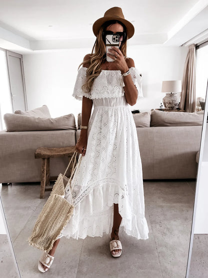 Find a White Maxi Beach Dress with an elegant strapless style and ruffle details. Perfect for summer outings and beach days.