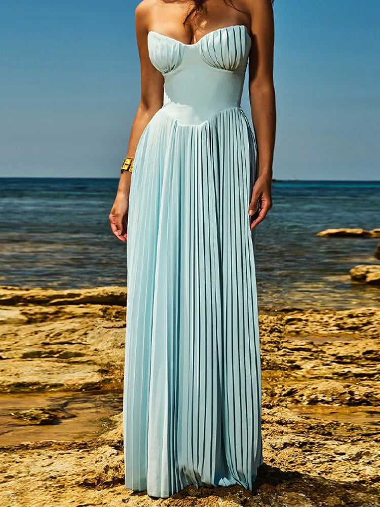 Elevate your occasion wardrobe with the Off-Shoulder Pleated Maxi Dress, featuring a sleek silhouette, and ankle-length design.